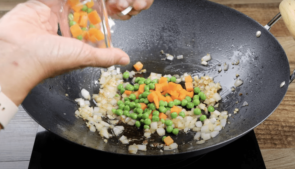 saute the onions, ginger and peas and carrots for the chicken fried rice